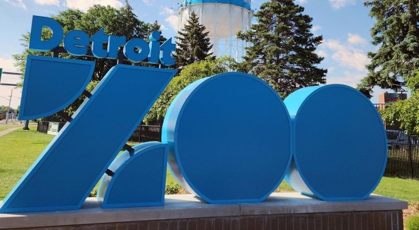 a sign with blue letters